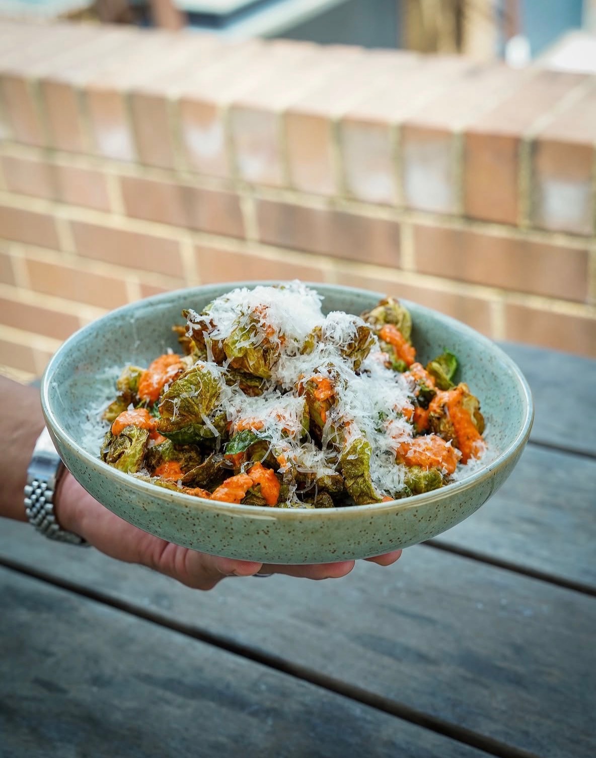 Crispy brussels sprouts with sauce and parmesan