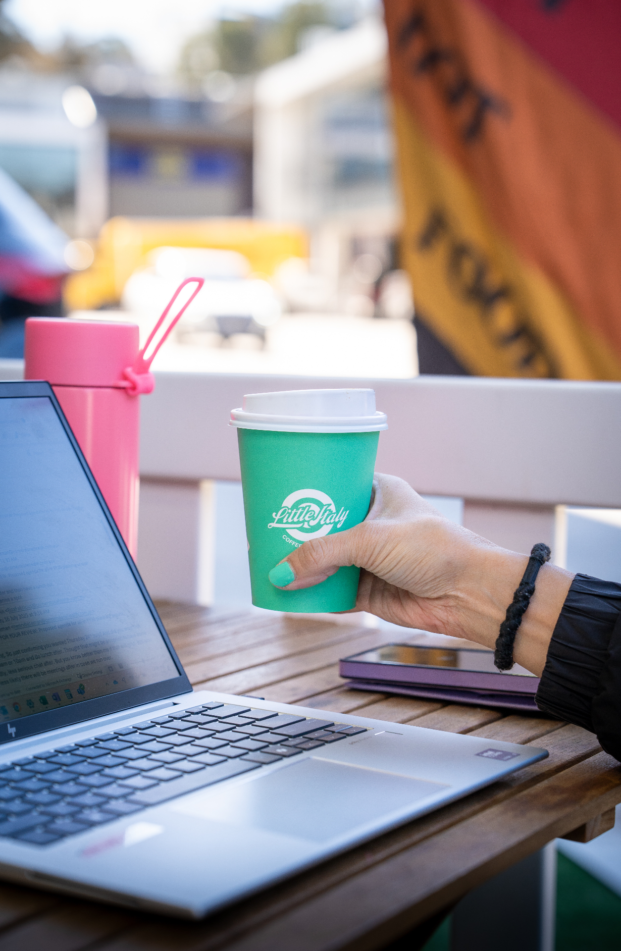 Little Italy coffee cup and laptop